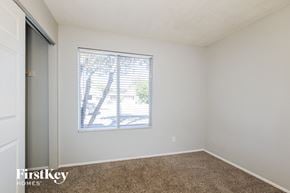 Phoenix house for rent - a bedroom with a window and a carpeted floor