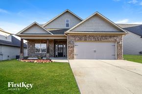 Calera house for rent - a house with a driveway and a garage door