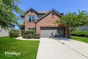 Calera house for rent - a home with a garage door in front of it