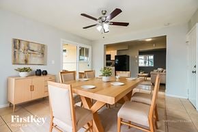Mesa house for rent - A dining room with a wooden table and chairs.