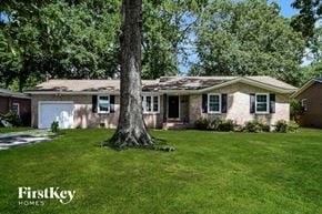 Charleston house for rent - A house with a tree in front of it.