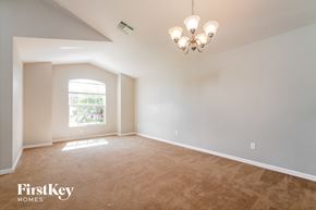 Kissimmee house for rent - the living room of an empty house with a window