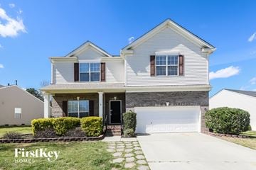 Indian Trail house for rent - a white house with a white garage door and a lawn