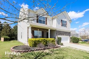 Indian Trail house for rent - a white house with a lawn and a tree