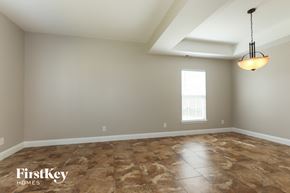 Indian Trail house for rent - the living room after remodeling with new flooring and a ceiling fan