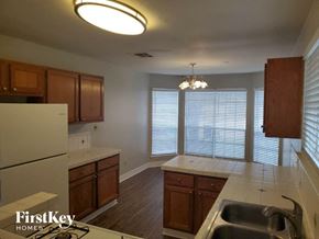 Katy house for rent - a kitchen with a sink and a refrigerator