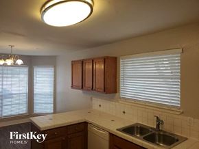 Katy house for rent - a kitchen with a sink and a window