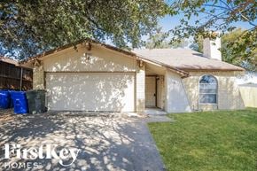 Carrollton house for rent - a house with a driveway and a garage door