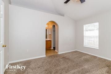Winter Haven house for rent - a living room with carpet and a door to a bathroom