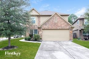 Humble house for rent - a house with a driveway and a garage door