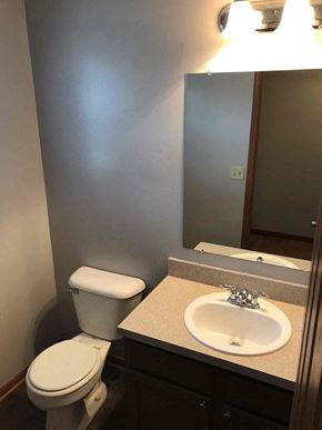 Grove City house for rent - a bathroom with a sink toilet and a mirror