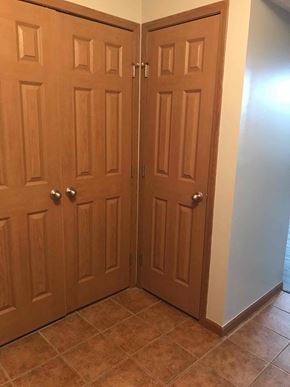 Grove City house for rent - a pair of doors in a room with a tile floor