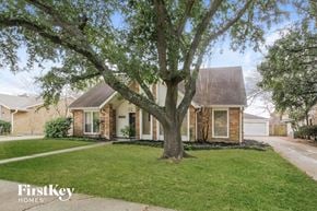 Katy house for rent - A house with a tree in front of it.