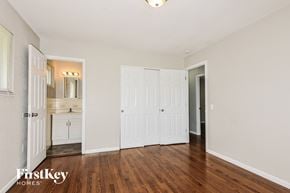 Florissant house for rent - a bedroom with two closets and a door to a bathroom