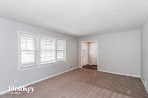 Lawrenceville house for rent - a living room with a hard wood floor and a large window