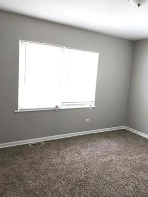Richton Park house for rent - a room with a window and a carpet