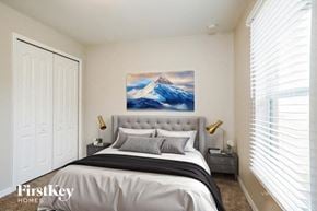 Cape Coral house for rent - A bedroom with a large bed and a painting of a mountain scene on the wall.