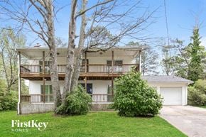 Morrow house for rent - A two-story house with a balcony and a garage.
