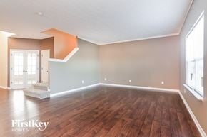 Avon house for rent - A room with wooden flooring and a window on the right side.