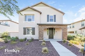 Buckeye house for rent - A house with a gravel driveway in front of it.