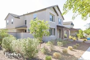 Buckeye house for rent - A house with a well-maintained garden in front.