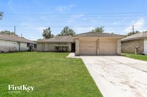 Spring house for rent - A house with a garage and a driveway is for sale.