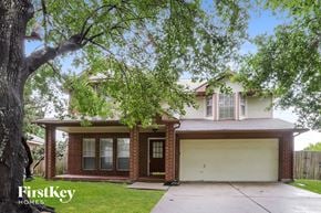 Katy house for rent - a brick house with a white garage door