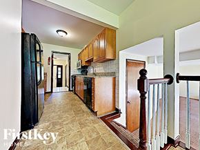Richton Park house for rent - a long hallway leading to the kitchen and the entrance to the living room