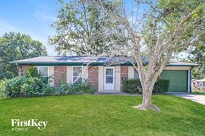 Florissant house for rent - A house with a tree in front of it.