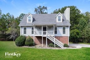 Helena house for rent - A house with a grey roof and a white porch.