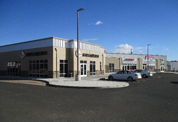 Yakima apartment for rent - A building with a sign that says "The Shop" on it.