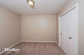 Birmingham house for rent - a bedroom with a carpeted floor and a door to a closet