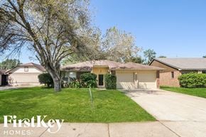Friendswood house for rent - a home in a neighborhood with a yard and a tree