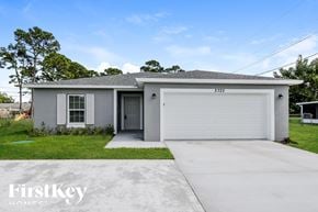 Port St. Lucie house for rent - A grey house with a white garage door and a black door.