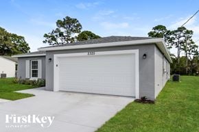 Port St. Lucie house for rent - A two-car garage with the number 2325 on the front door.