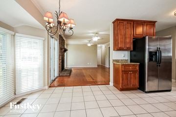 Charleston house for rent - a kitchen with a stainless steel refrigerator and cabinets