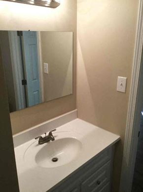Decatur house for rent - a bathroom with a sink and a mirror