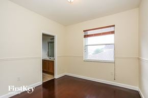 Homestead house for rent - a living room with a window and a door to a bathroom