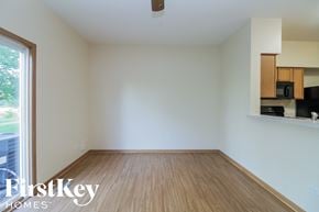 Plainfield house for rent - an empty living room with wood flooring and a window