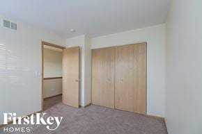 Plainfield house for rent - a master bedroom with two closets and a carpeted floor