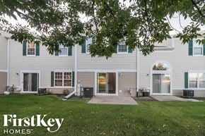 Plainfield house for rent - the exterior of a white house with green shutters and a lawn