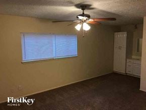 Sugar Land house for rent - a living room with a ceiling fan and a window