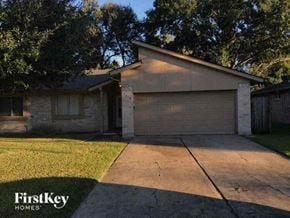 Sugar Land house for rent - a house with a driveway and a garage door