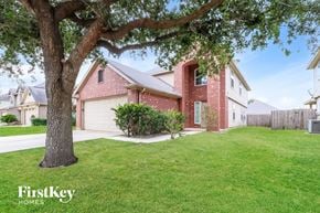Houston house for rent - A house with a tree in front of it.