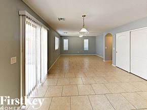 Phoenix house for rent - the living room and dining room of a house with a large tile floor