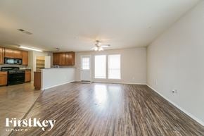 Hockley house for rent - an empty living room with wood flooring and a kitchen