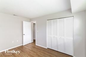 Port Charlotte house for rent - a bedroom with two closets and a door to a hallway
