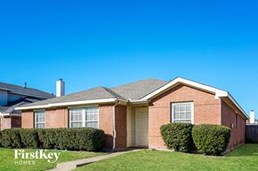Lancaster house for rent - a brick house with a yard and a blue sky