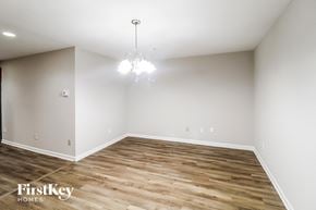 Decatur house for rent - a living room with wood flooring and white walls