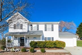 Winston-Salem house for rent - a white house with a porch and a blue sky
